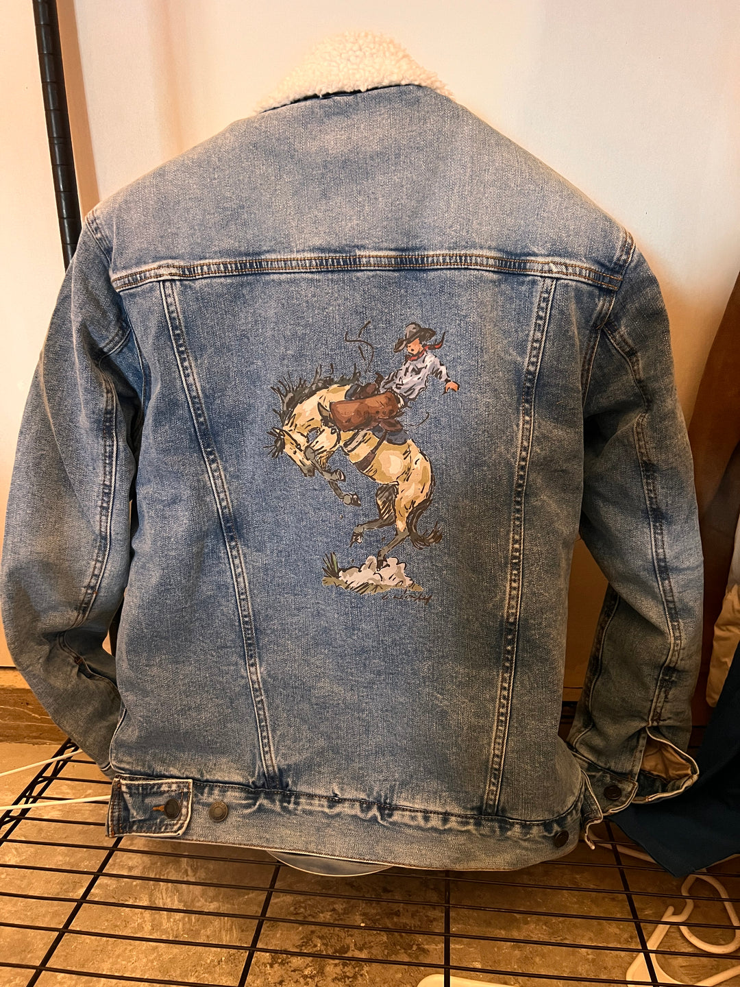 Denim jacket with pressed design 