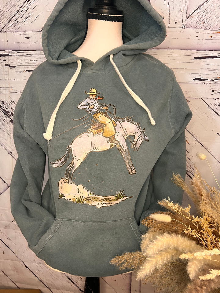 A gray hoodie featuring a western graphic hoodie/crewneck design with a cowboy and a bucking horse.