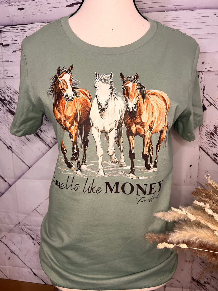 A sage green unisex cotton t-shirt with a graphic print of three horses trotting and the text &