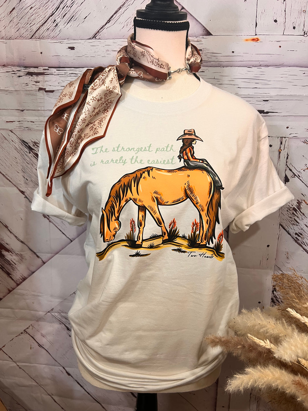 White shirt with horse design on a wooden background