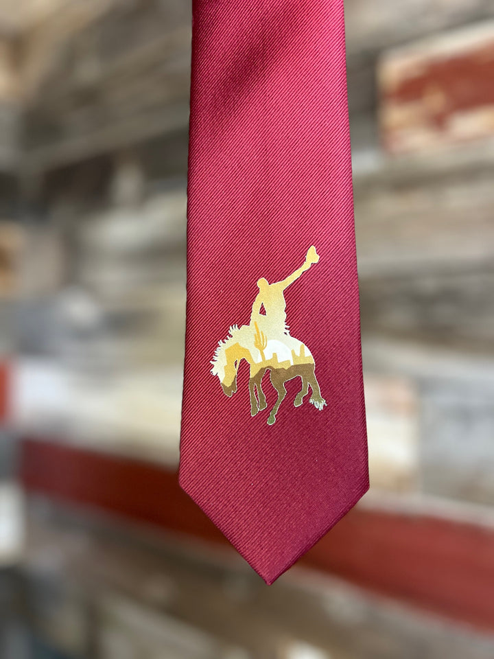 Red tie with a gold emblem of a horse on a blurred background