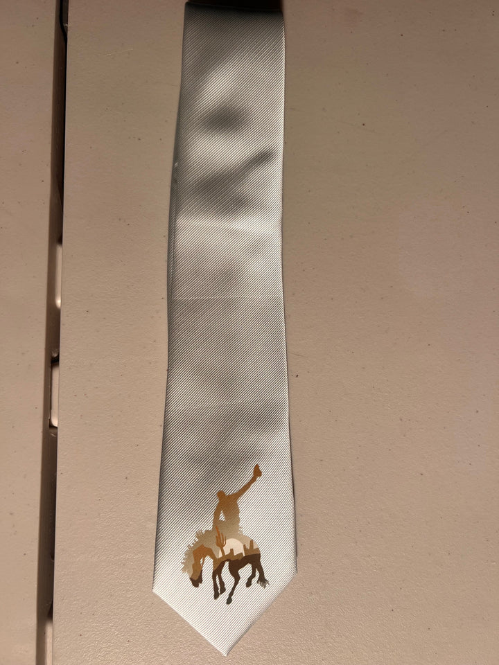 White tie with a horse design on a beige background