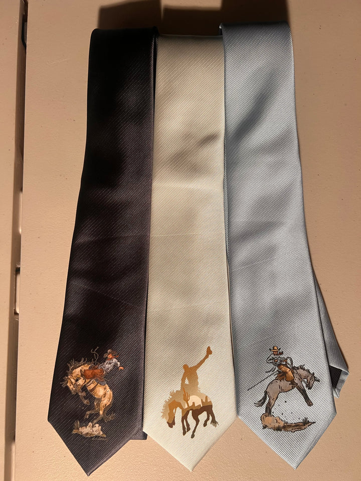 Three neckties with printed designs