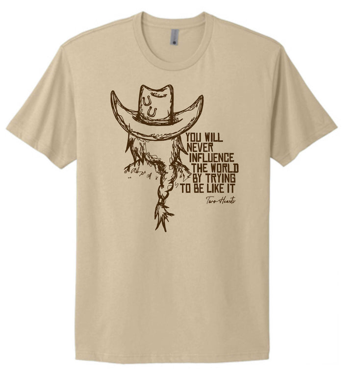 Beige t-shirt with a graphic of a cowboy hat and text on a white background