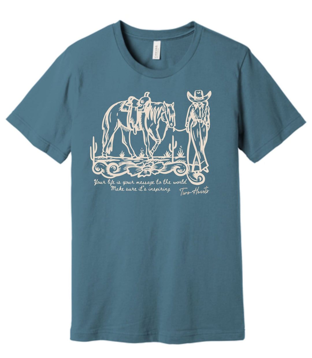 Blue t-shirt with white graphic of a cowboy and horses on a white background