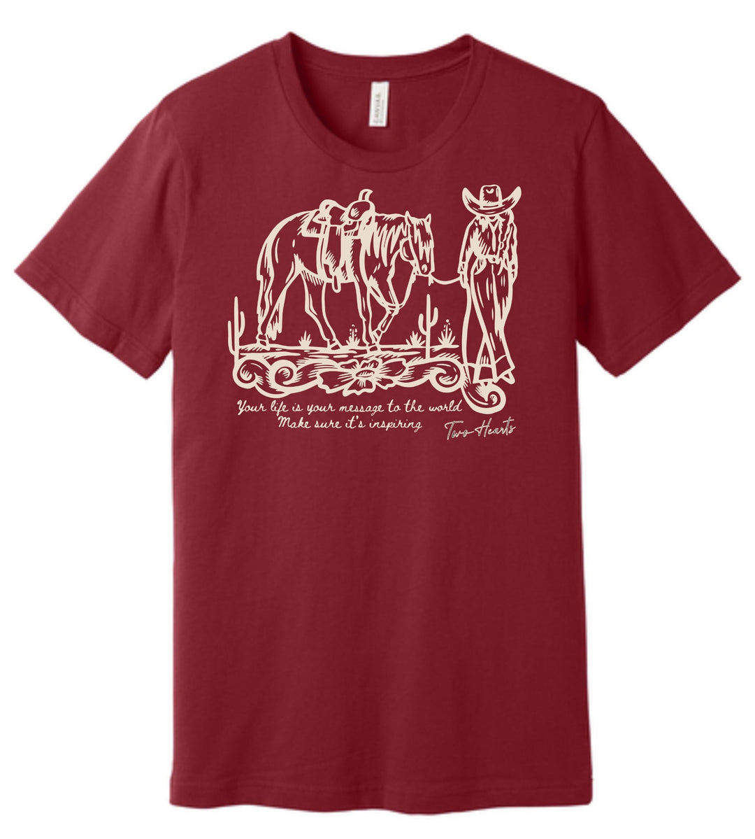 Maroon t-shirt with white graphic of a cowboy and horse, and text on a white background