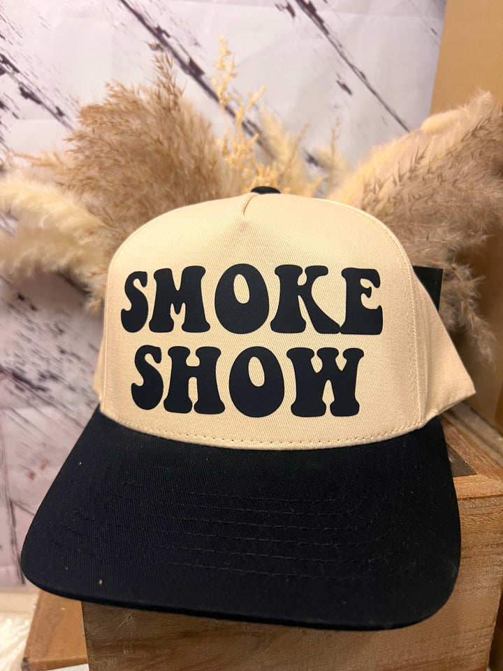 A western-inspired ballcap with a khaki crown and black bill, featuring the text &