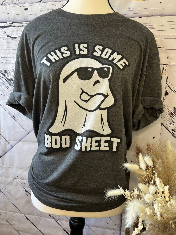 Black frost colored graphic tee with a printed ghost and sunglasses design, and the text &